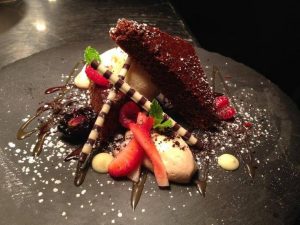 Chocolate stout cake/salted caramel ice cream/espresso mousse from Epic Restaurant.